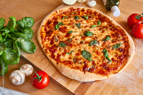 Homemade Margarita Flatbread Pizza with Tomato and Basil.