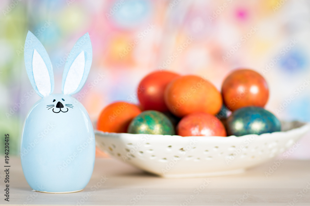 Easter decoration with rabbit and painted eggs