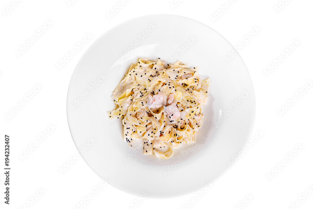Pasta, noodles with fish and sesame, decorated with cheese. Isolated white view from above Serving a meal in a cafe, restaurant. Pasta, noodles with fish and sesame, decorated with cheese. Isolated white view from above Serving a meal in a cafe, restaurant.