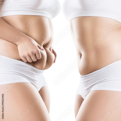 Side view of woman with fat belly. Obesity concept. photo