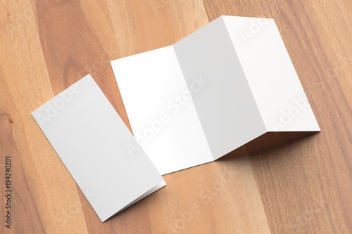 Thrifold - Three fold brochure mock up on wooden background. 3d illustrating.
