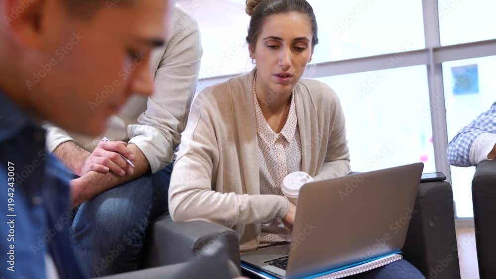 Group of students in lounge room with teacher Group of students in lounge room with teacher