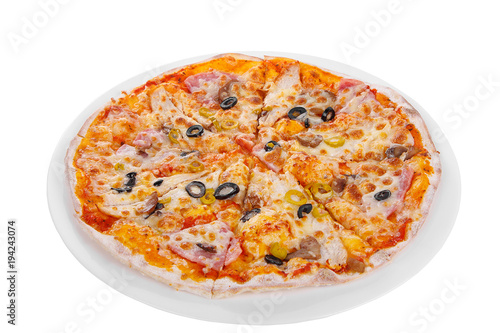 Pizza whole round, cut into pieces, on a white isolated background. Fast food in a pizzeria, a floury cheese product. Side view