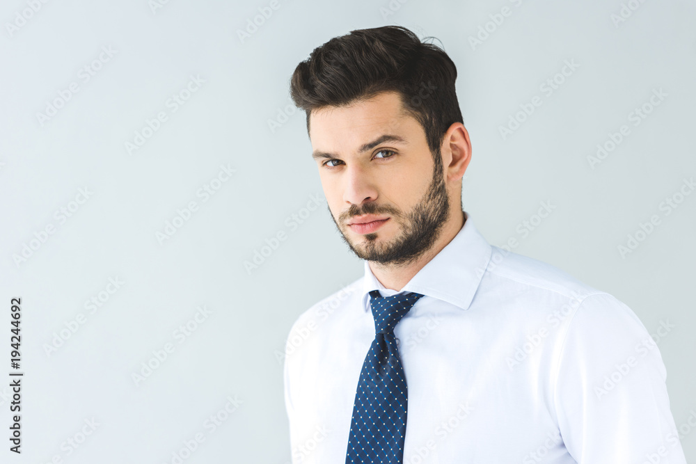 handsome businessman in white shirt and tie, isolated on grey handsome businessman in white shirt and tie, isolated on grey