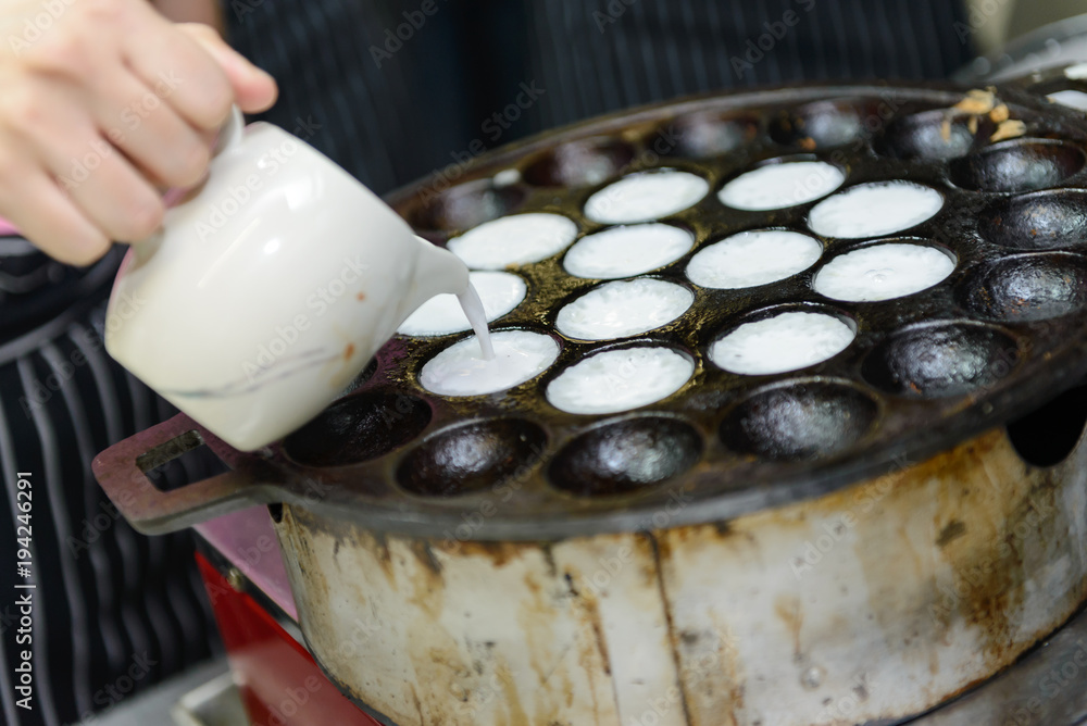 Thai Coconut pudding - Kanom Krok, Coconut milk mix sugar and flour, Thai Street food Thai Coconut pudding - Kanom Krok, Coconut milk mix sugar and flour, Thai Street food