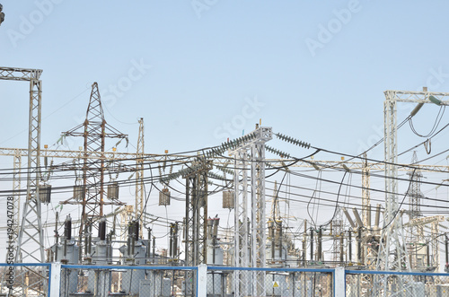 High-voltage transformers and power line supports. blue sky without clouds. Russia. Siberia. Power station.