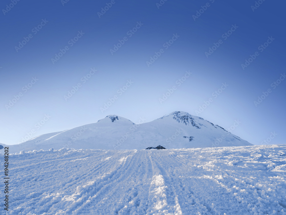 snow-covered slope of Mount Elbrus, a view of the icy peaks and 