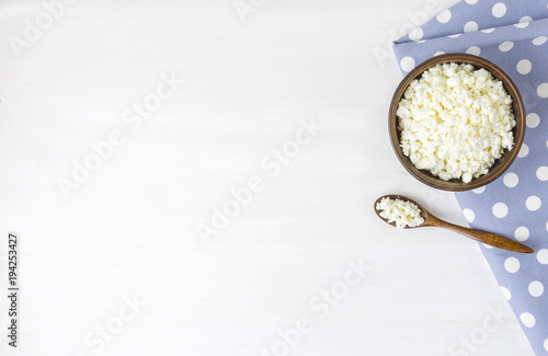 Cottage cheese with apples for breakfast in a bowl close up. Top view image. Cottage cheese with apples for breakfast in a bowl close up. Blue polka dot napkin. Top view image. Copyspace for your text © Irina Sokolovskaya