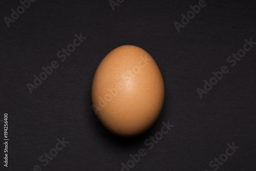 Egg close-up on a black background. View from above