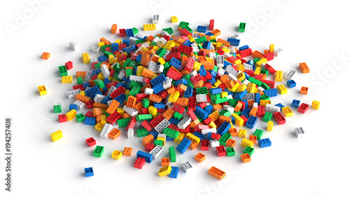 Pile of colored toy bricks isolated on white background. Multicolored toy bricks