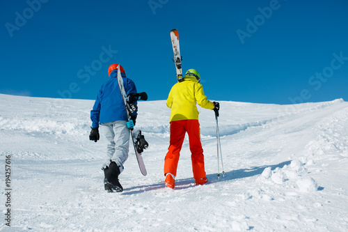 Photo of sports couple falling with snowboard