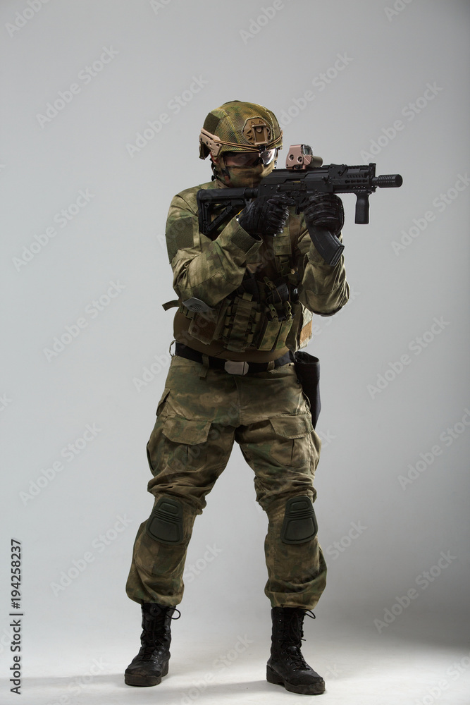 Photo of military man with gun Photo of military man with gun