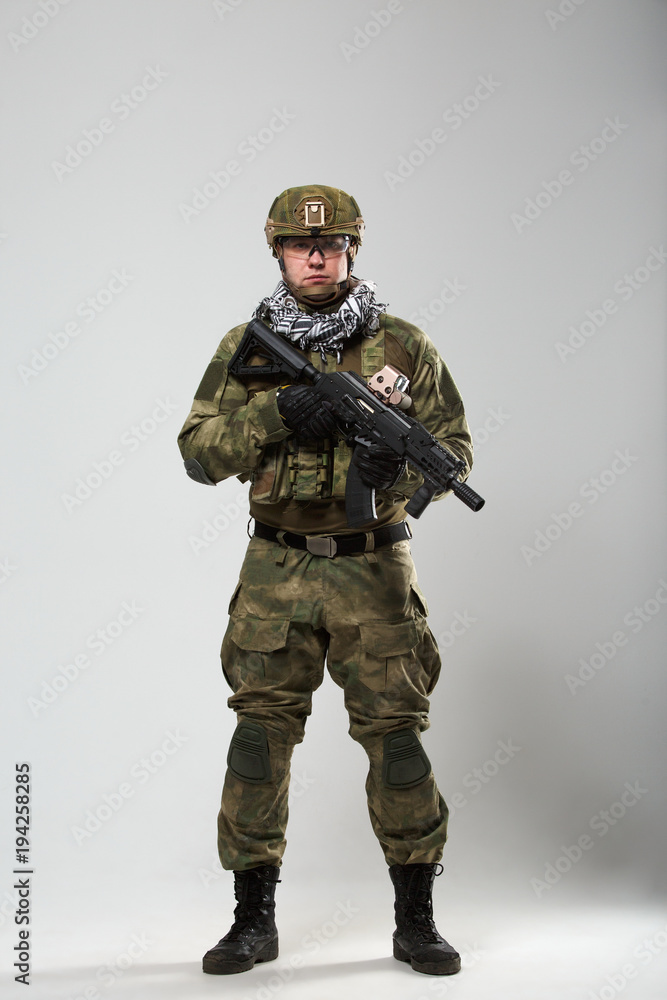 Full-length photo of soldier with gun in his hand Full-length photo of soldier with gun in his hand