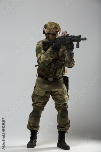 Photo of military man with gun