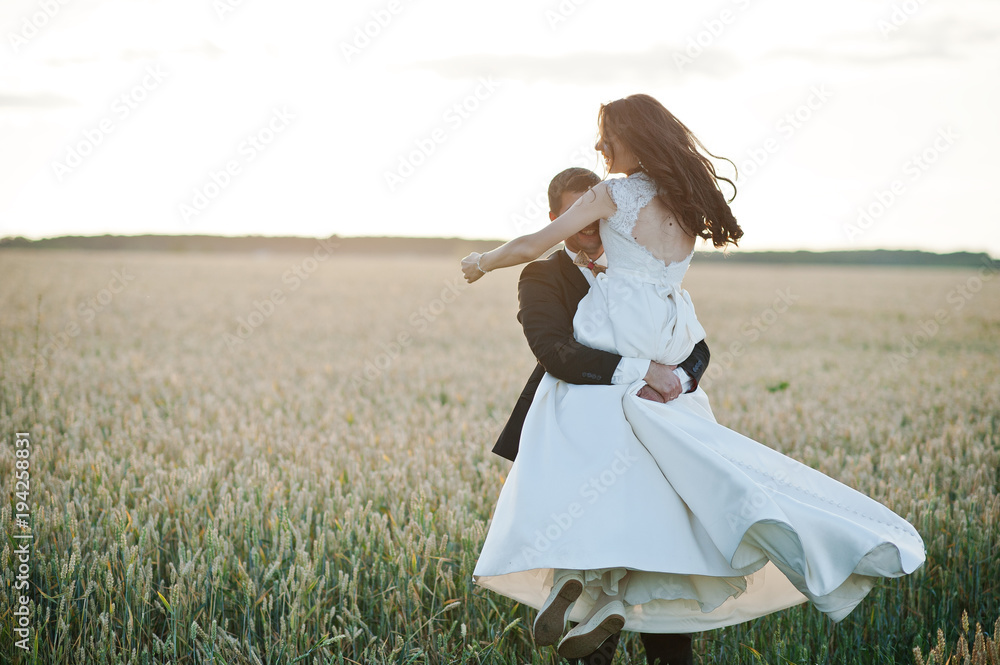 Loving wedding couple at field of wheat. Loving wedding couple at field of wheat.