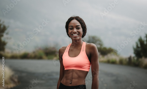 Young woman athlete on road