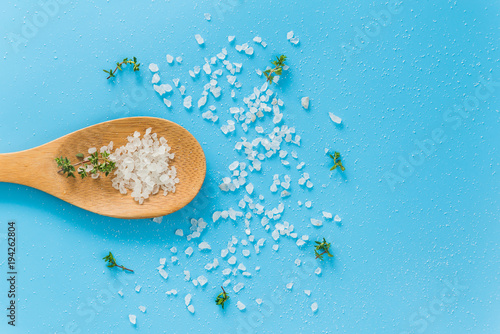 sea salt on a bamboo spoon and fresh organic thyme
