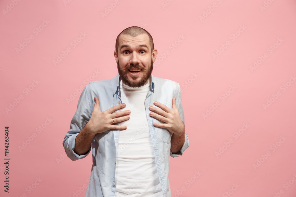 Let me think. Doubtful pensive man with thoughtful expression making choice against pink background Let me think. Doubtful pensive man with thoughtful expression making choice against pink background