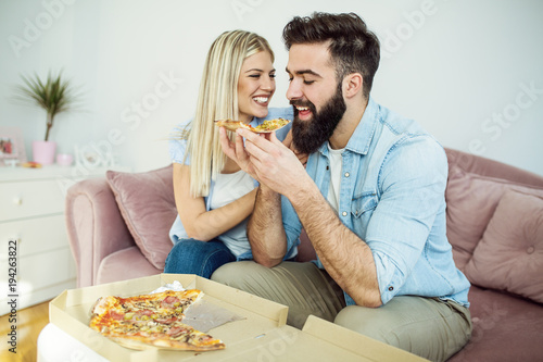 Couple enjoying pizza