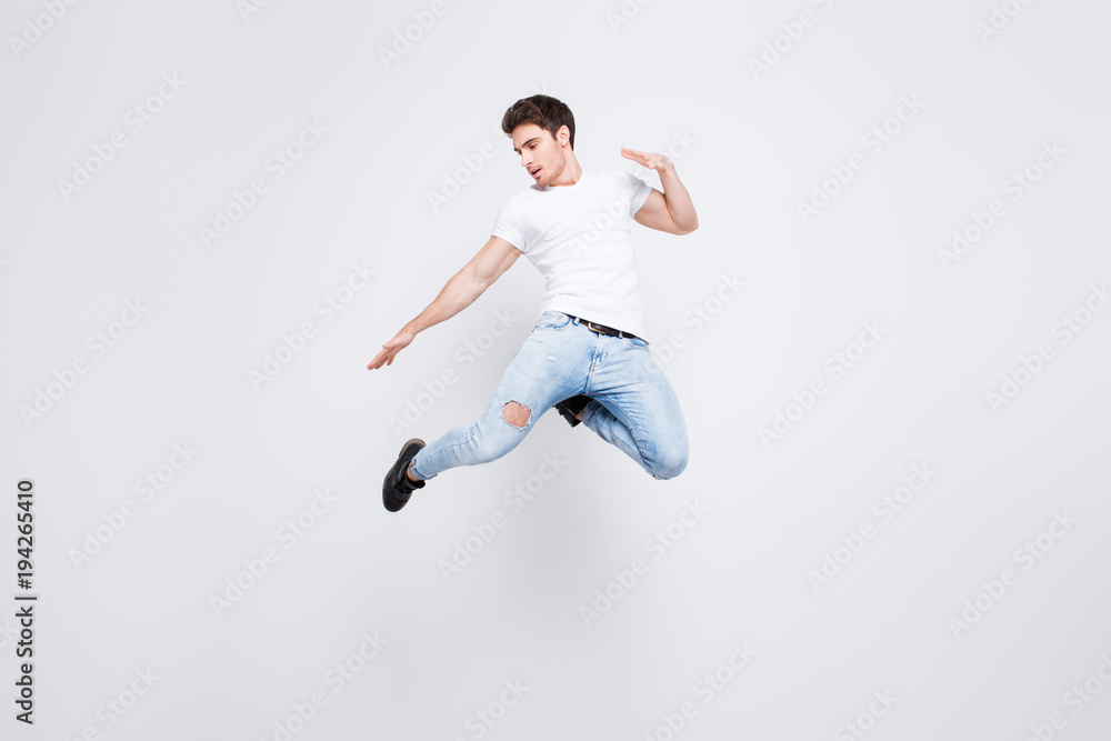 Success win winner achievement goal lifestyle leisure sexy people person cool swag people person concept. Full-length full-size portrait of attractive muscular guy jumping up isolated gray background