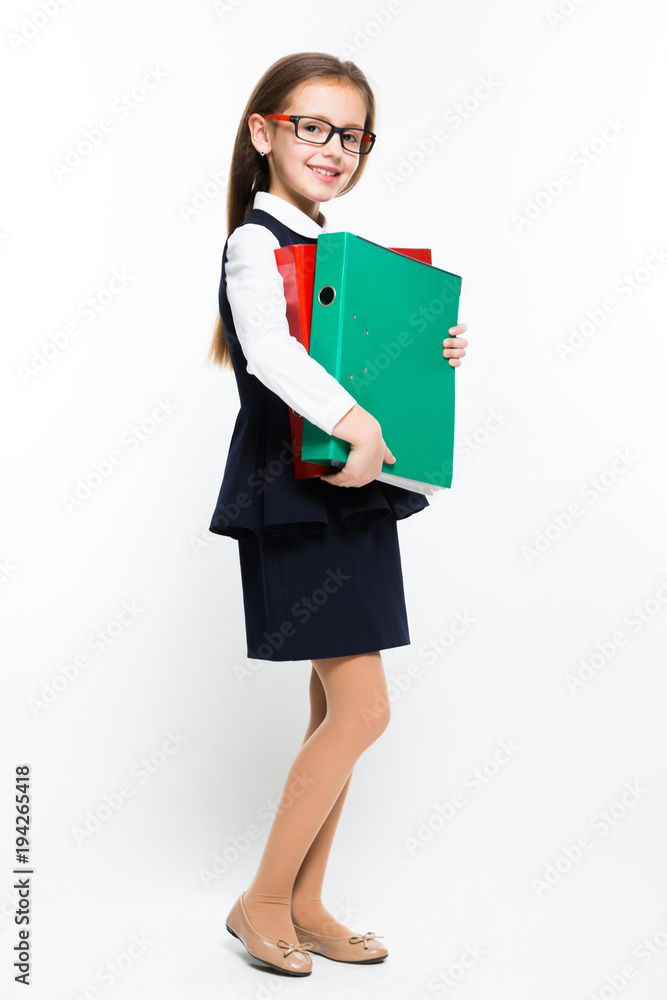 Little girl with binders in her hands dressed as a businesswoman Little girl with binders in her hands dressed as a businesswoman
