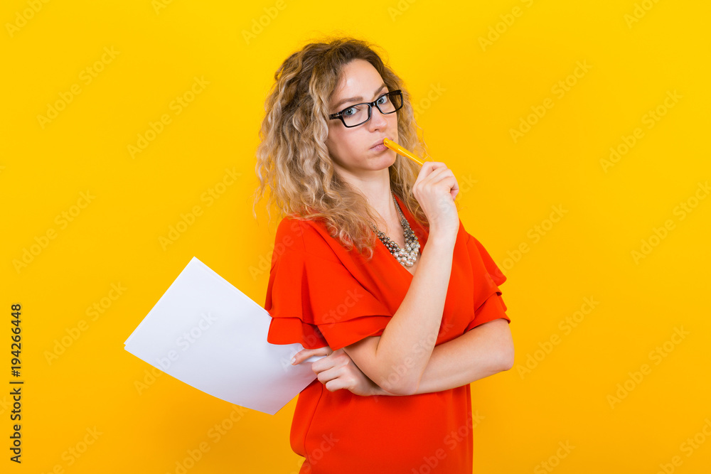 Woman in dress with blank paper and pencil Woman in dress with blank paper and pencil