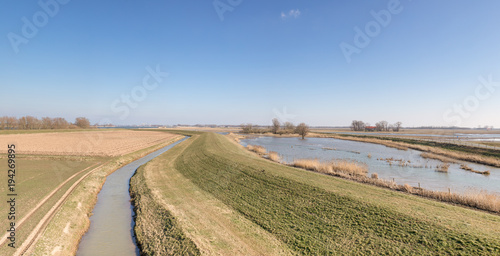 The polders - meadows, water and reed in the Natur Park "Biesbosch" in Holland. Dutch winter landscapes on a sunny day.