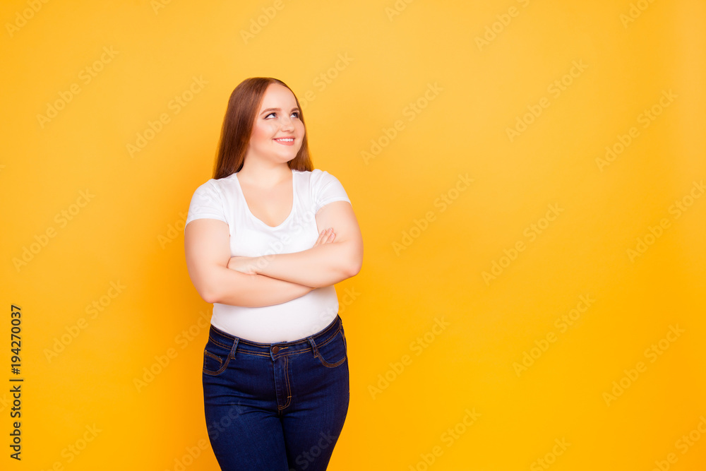 Young woman smiles and crosses arms Young woman smiles and crosses arms
