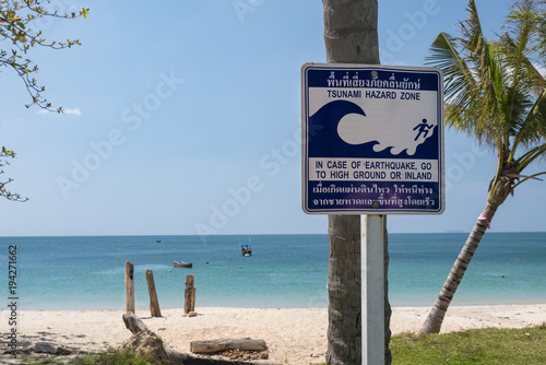 tsunami signboard in the beach, thailand, ko lanta island