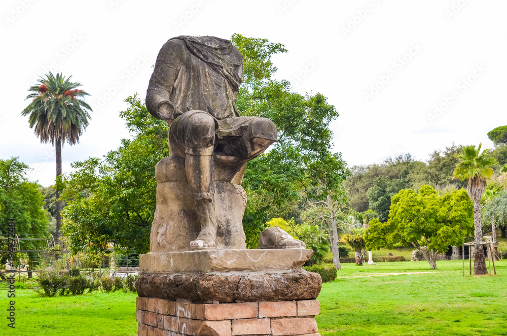 Antique ruined statue in park in Rome, Italy Antique ruined statue in park in Rome, Italy