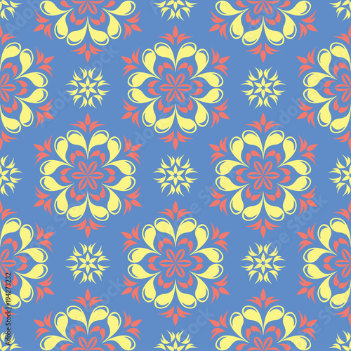 Floral seamless pattern. Blue background with colored flower elements © Liudmyla