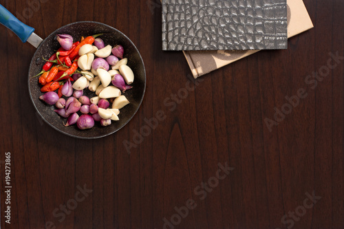 Raw ingredients - herbs and spices lay flat image on wooden table top