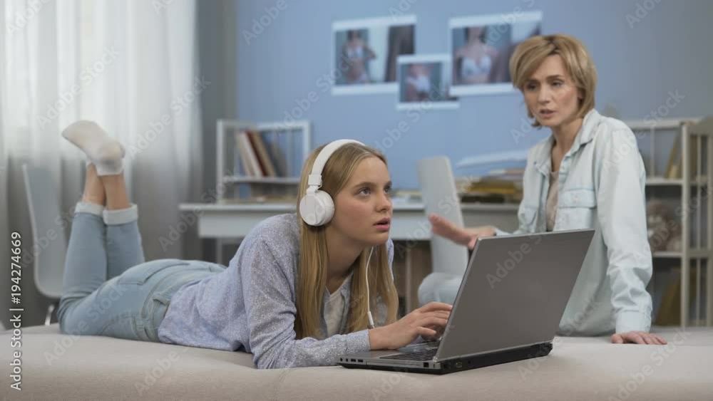 Mother scolds daughter, troubled teenager spends too much time in social media Mother scolds daughter, troubled teenager spends too much time in social media