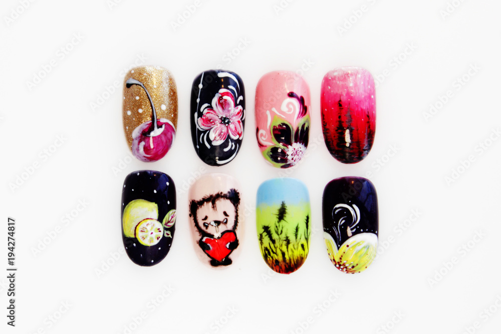 many plastic pink tips for nail extension and training in applying design while training a manicure. trial student work in the form of monograms, flowers and animals, with pasted pastes. many plastic pink tips for nail extension and training in applying design while training a manicure. trial student work in the form of monograms, flowers and animals, with pasted pastes.