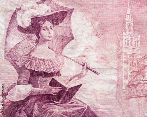 Young lady with umbrella portrait on old spainish 100 pesetas banknote close-up