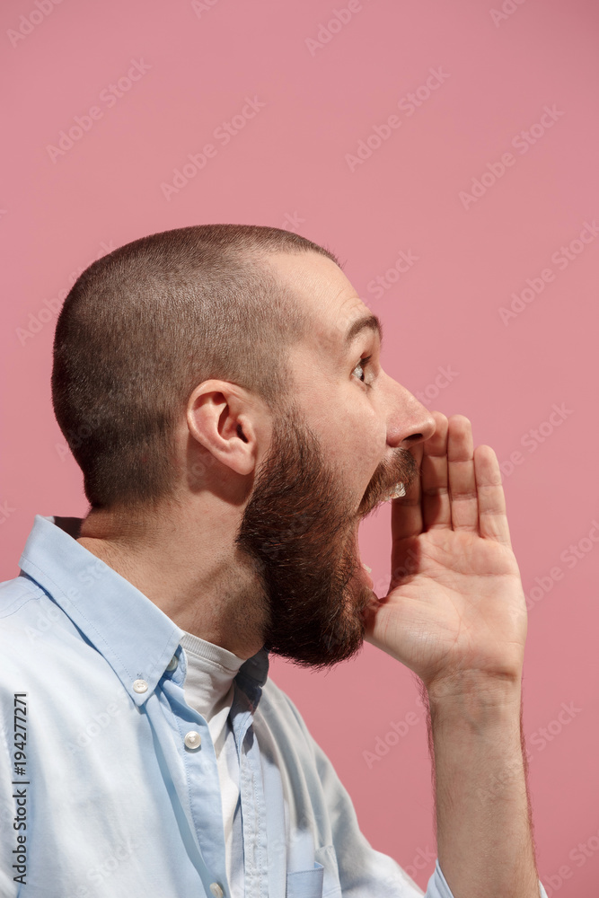 Isolated on pink young casual man shouting at studio Isolated on pink young casual man shouting at studio