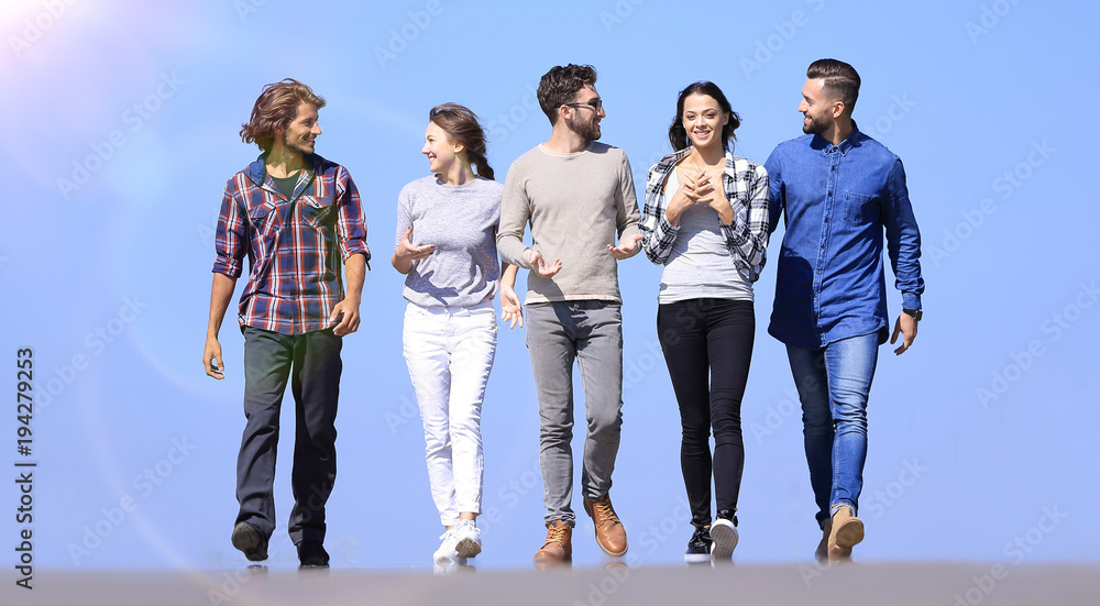 Fototapeta premium young people walking along the road.