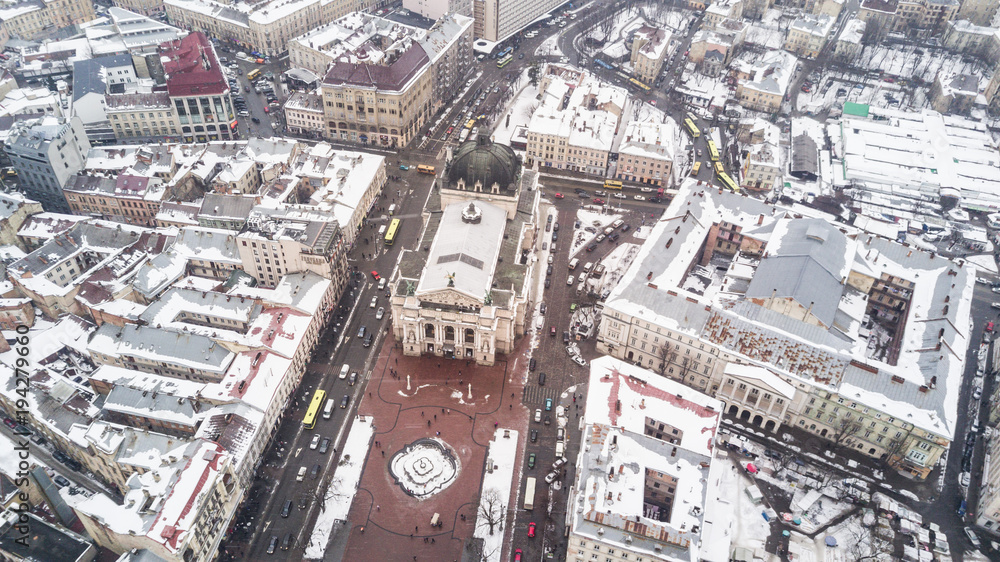 Fototapeta premium February, 2018 - Lviv, Ukraine. Top View of Lviv City Centre in snow from above in winter. Lviv national theatre.