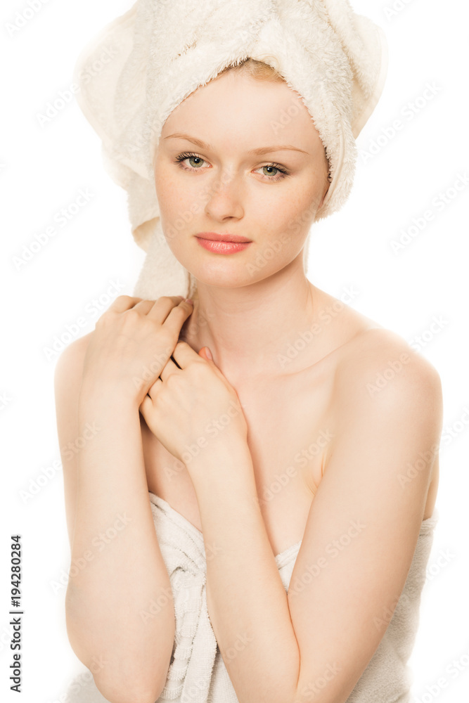 beautiful young woman with clear skin in white towel isolated beautiful young woman with clear skin in white towel isolated