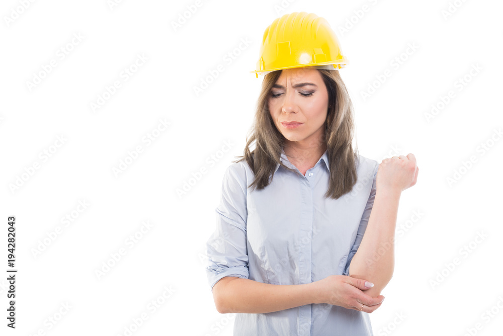 Portrait of female constructor holding her elbow. Portrait of female constructor holding her elbow.
