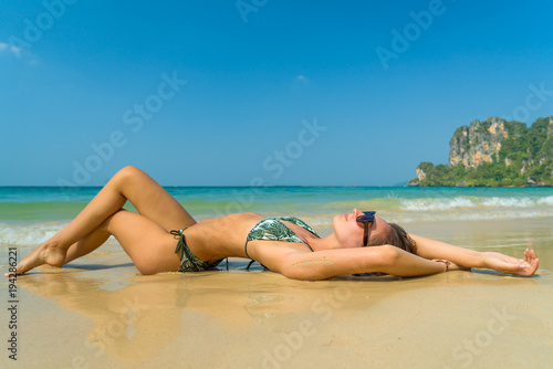 woman resting at the tropical Thailand Railay beach in Thailand