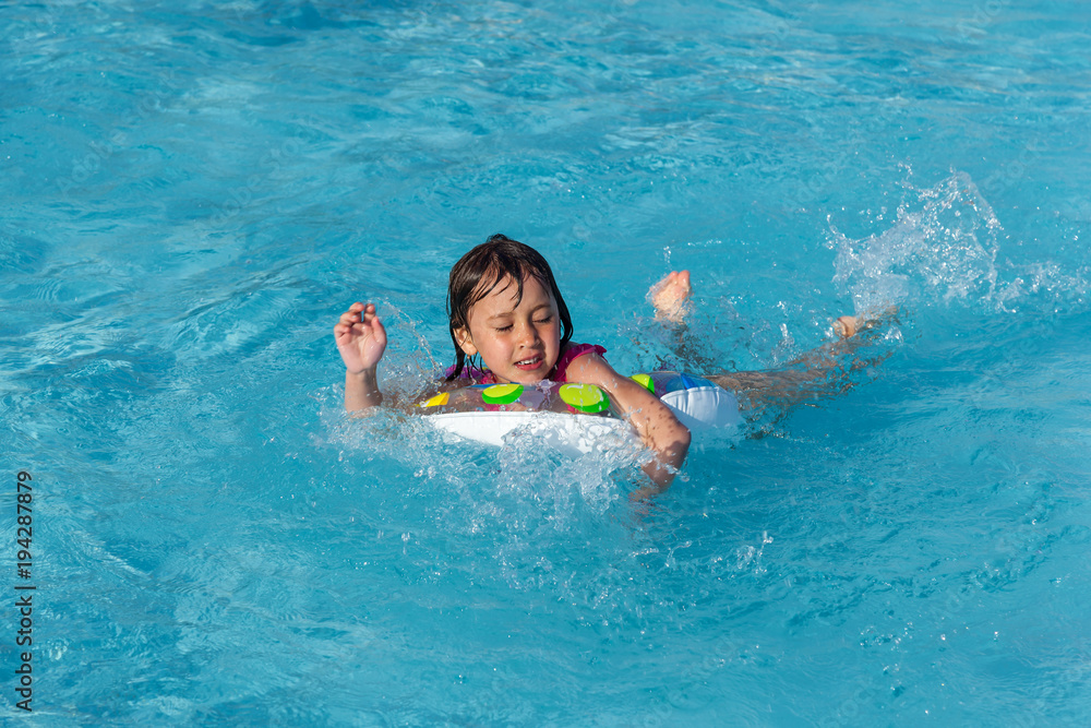 little girl in the swimming pool