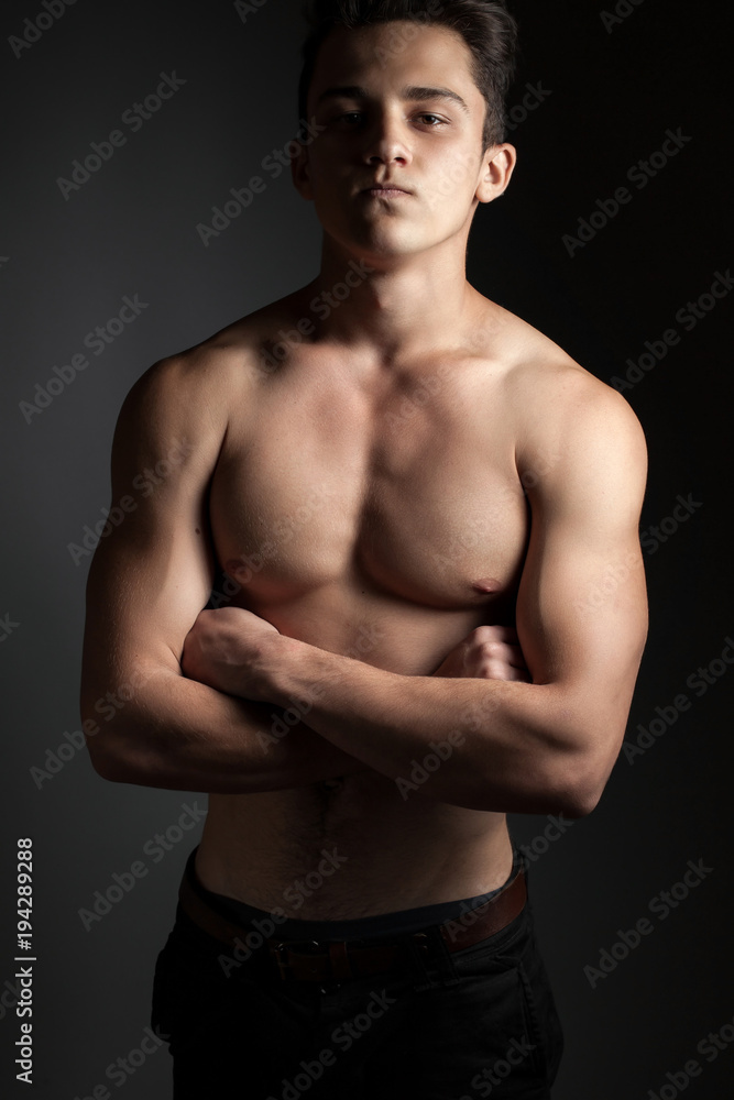 Fototapeta premium Athletic man on a black background