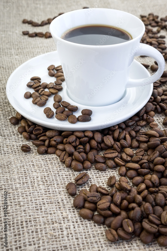 Fototapeta premium Cup of coffee in burlap