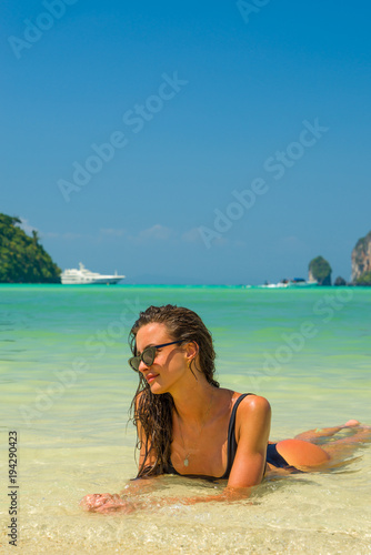 Woman relaxing on the beach in Koh Phi Phi Don in Thailand