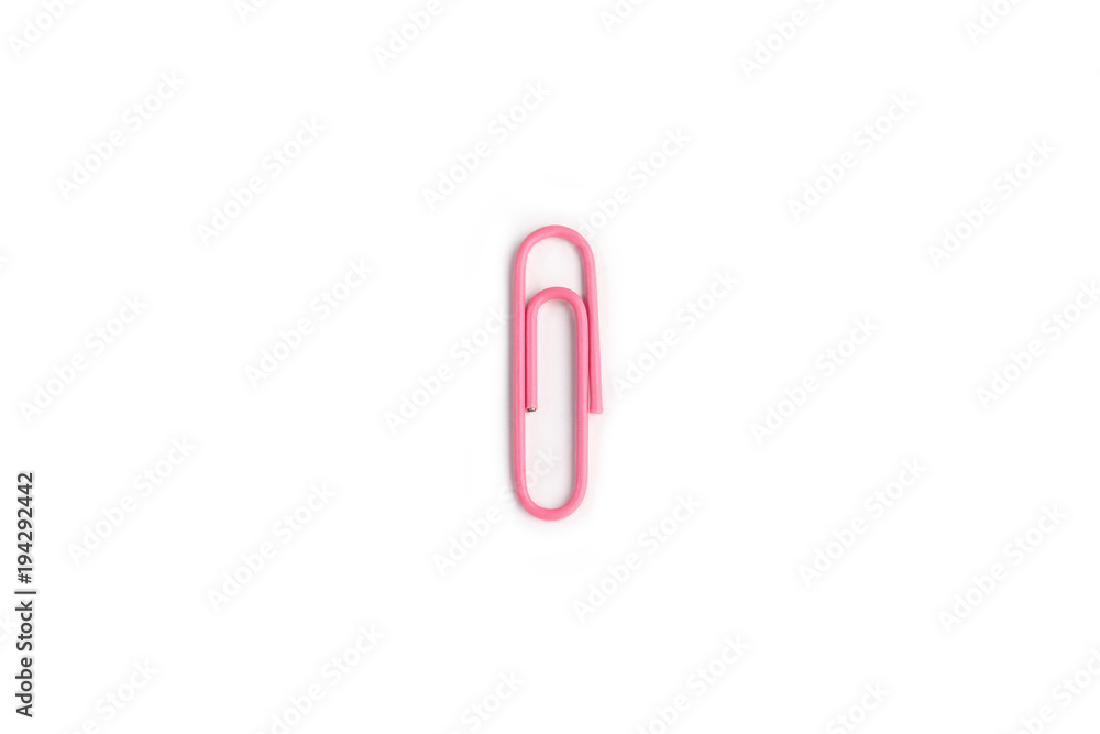 Pink  paper clip on a white background.