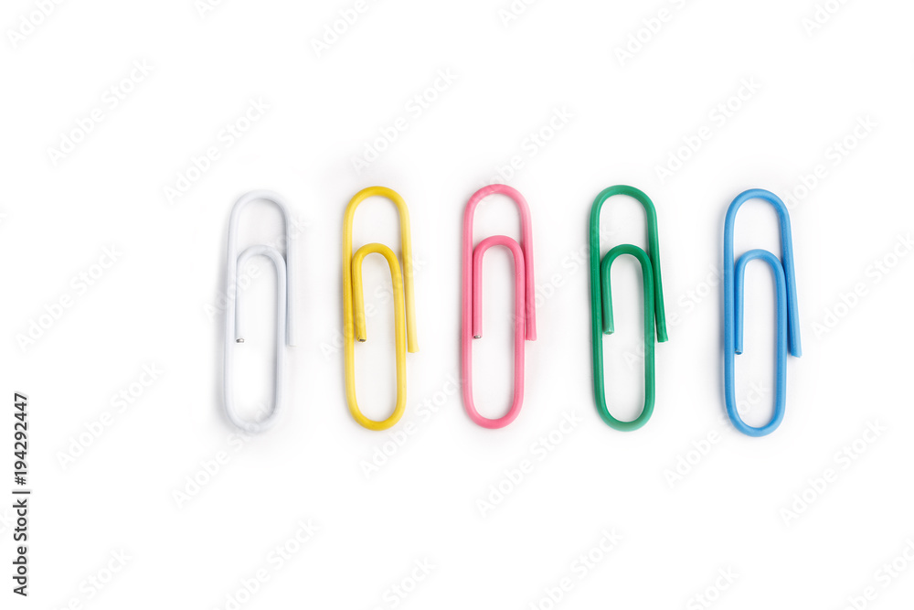 A lot of colorful paper clips on white background. A lot of colorful paper clips on white background.