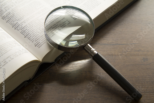 Eyeglasses on an opened text book