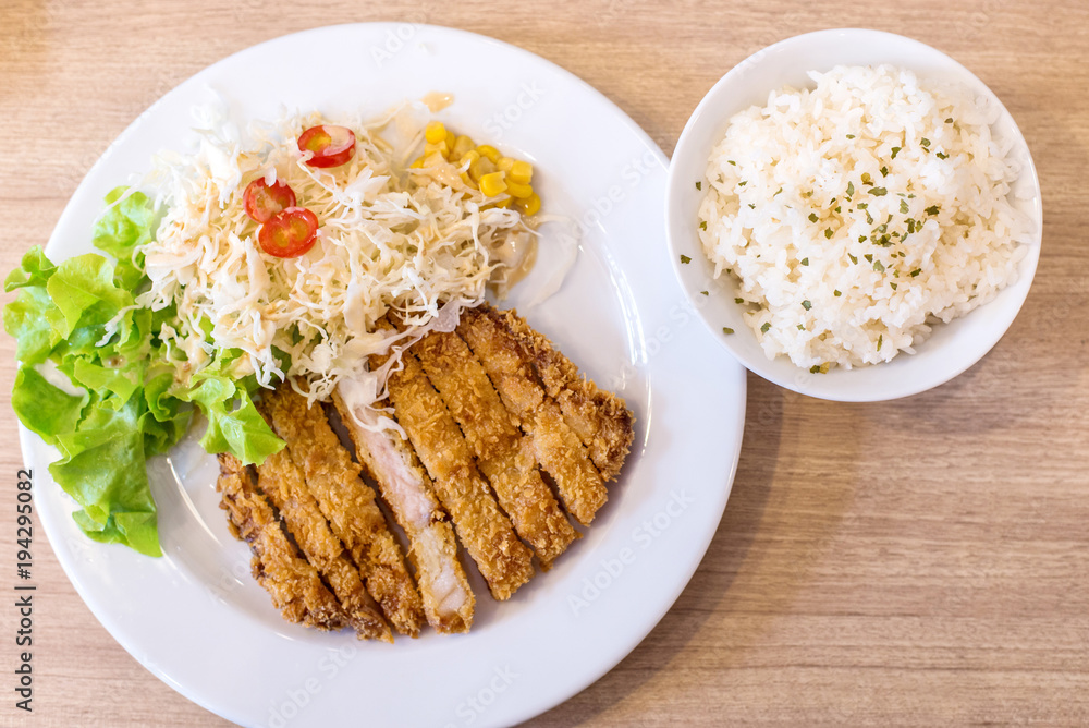 deep fried pork (tonkutsu) most delicious famous japanese food in white disc on wood background deep fried pork (tonkutsu) most delicious famous japanese food in white disc on wood background