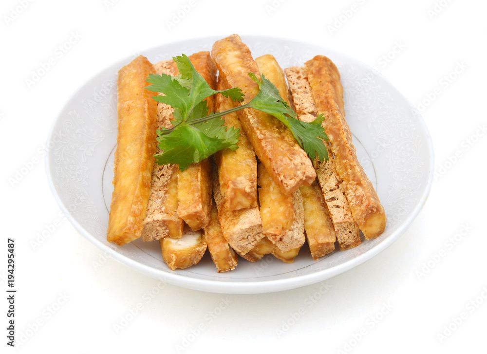 Fried Tofu in white plate on white Fried Tofu in white plate on white